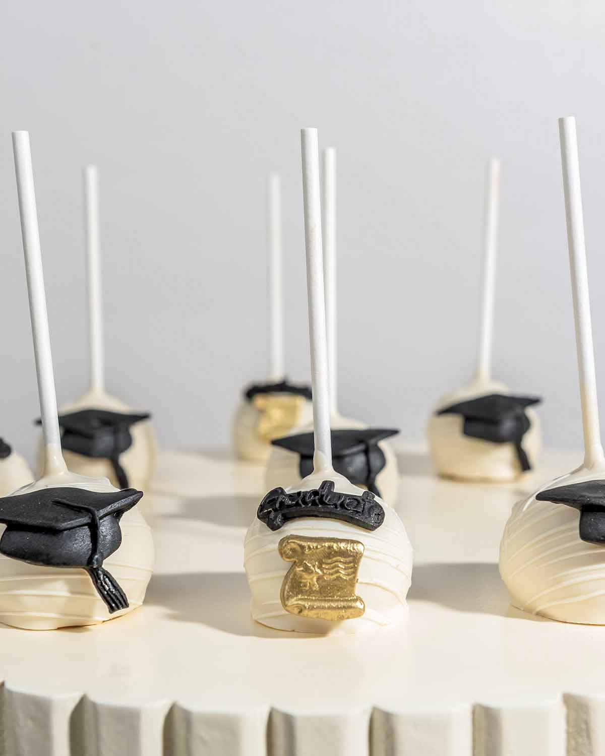 White Chocolate Graduation Cake Pops